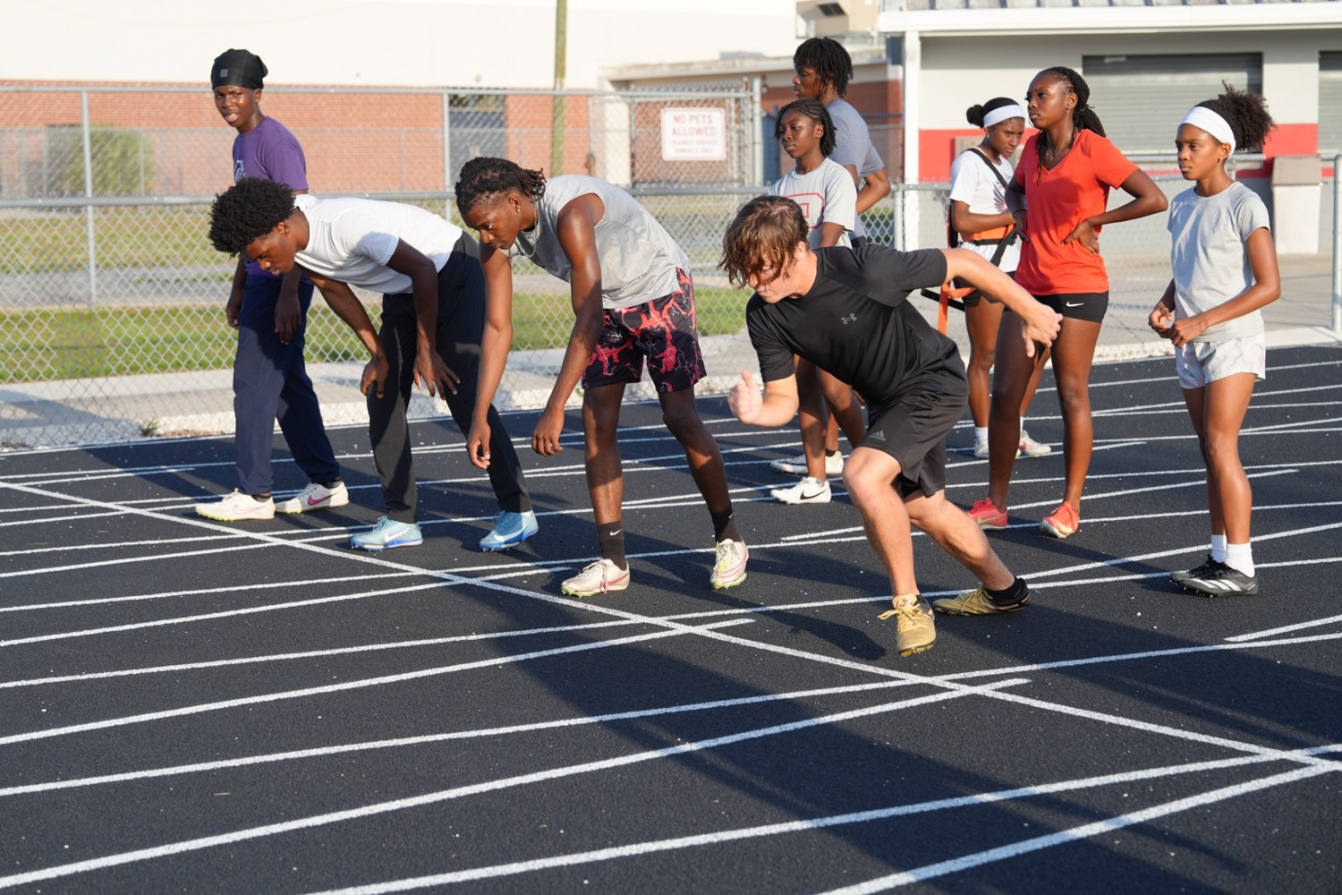 Young athletes practicing their starts on the track